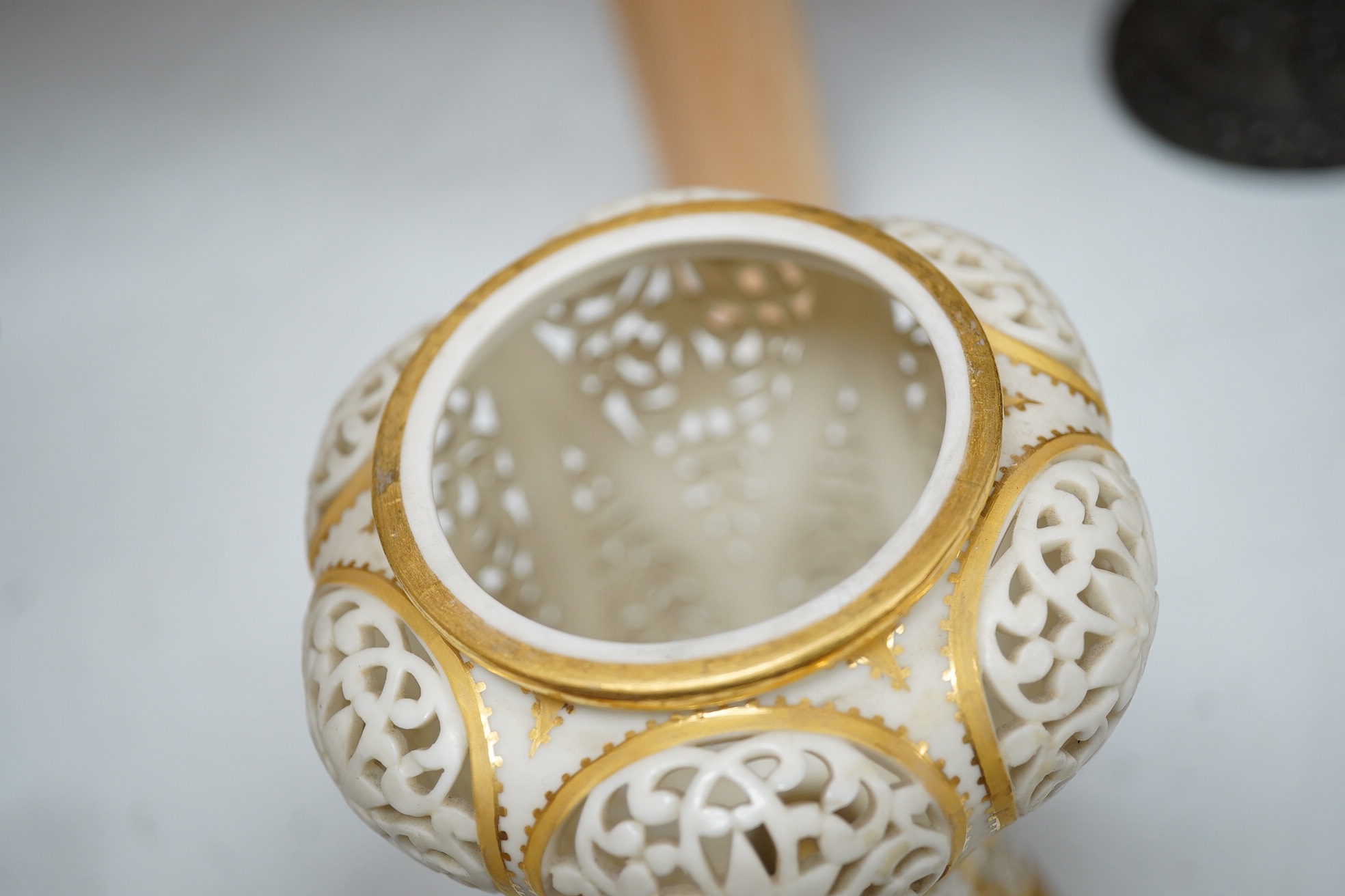 A Grainger's reticulated vase and cover, with gilded decoration, 24cm high. Condition - cover broken and repaired